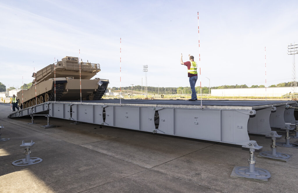 Over-Decking System configured for offloading a tank from a railcar using recently assembled decking system