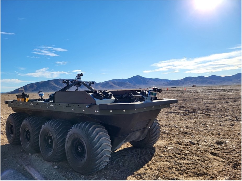 A military vehicle sits in the desert.