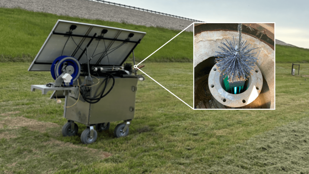 Solar panel cart with a rectangular device with a brush on each end and a light in the center