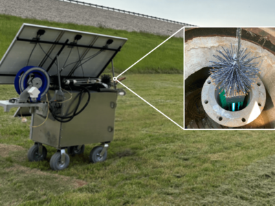 Solar panel cart with a rectangular device with a brush on each end and a light in the center